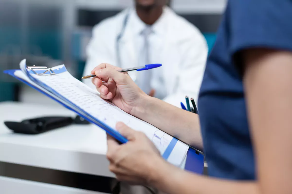 Closeup Patient Writing Medical Document